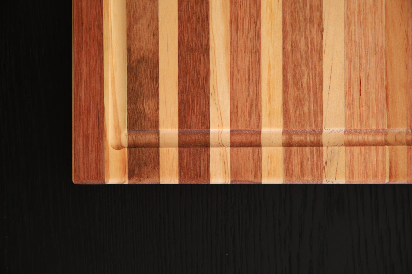 Close-up of handcrafted Tasmanian Oak timber grain and juice groove