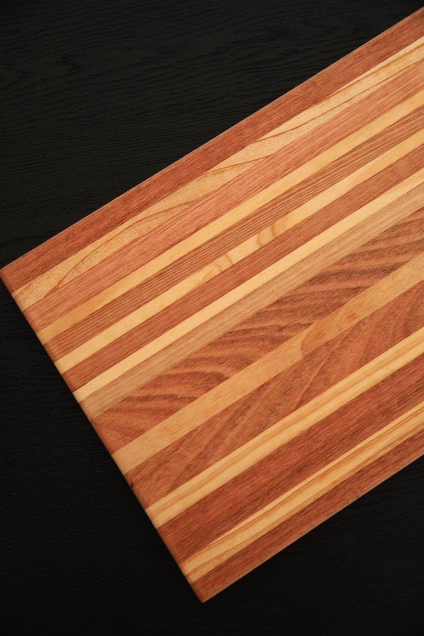 Angled view of The Entertainer Board showcasing the natural grain, premium Tasmanian Oak and handcrafted finish.