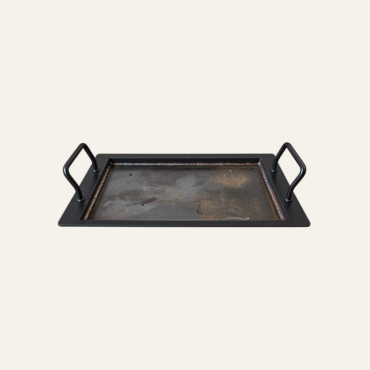Removable hot plate for The Forge Fire Pit with two handles and large steel cooking surface